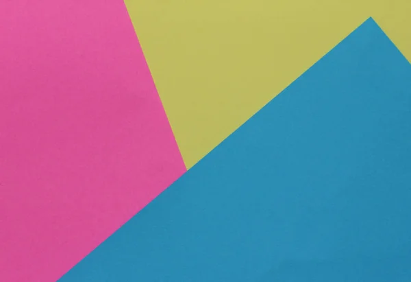 Yaratıcı geometrik Kağıt arka plan. Pembe, mavi, sarı renkler. Soyutlama. Şablon. Üstten görünüm.