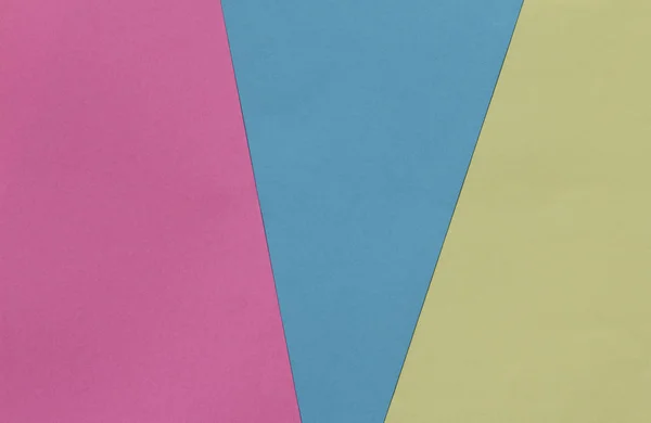 Yaratıcı geometrik Kağıt arka plan. Pembe, mavi, sarı pastel renkler. Soyutlama. Şablon. Üstten görünüm.