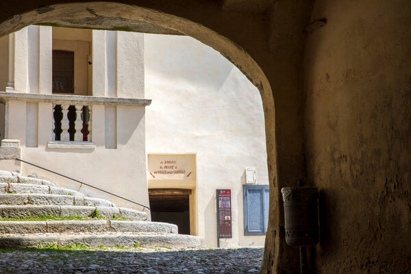 Sacro Monte (VA), Italy - June 01, 2020: An old passage at pilgrimage village of Santa Maria del Monte on Sacro Monte di Varese, UNESCO World Cultural Heritage Site, Santa Maria del Monte, Varese, Lombardy, Italy
