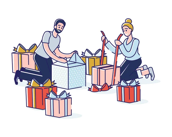Erkek ve kadın hediye kutularını birlikte paketliyor. Birkaç hediye paketini dekoratif kağıda sardım.