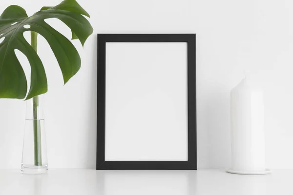 Black Frame Mockup Candle Monstera Leaf Vase White Table Portrait — Stock Photo, Image