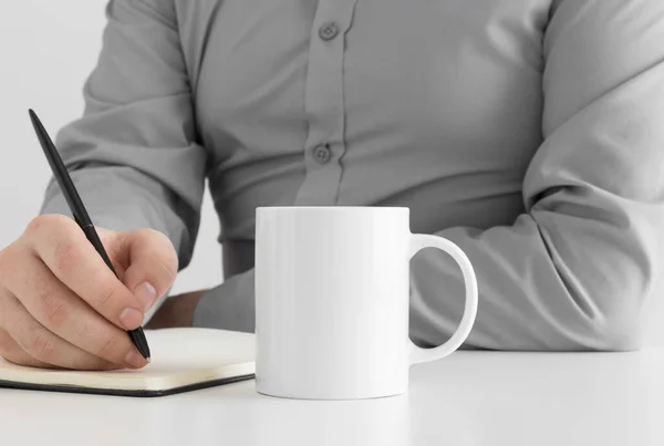 White Mug Mockup Man Taking Notes — Stock Photo, Image