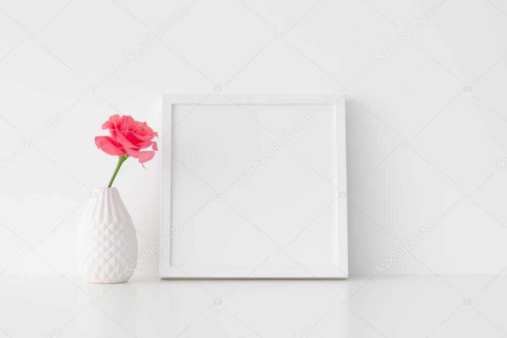 White square frame mockup with pink rose in a vase.