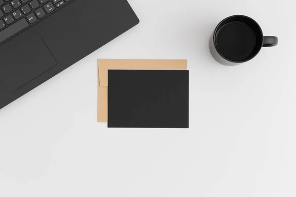 Top View Black Card Mockup Envelope Laptop Cup Coffee White — Stock Photo, Image