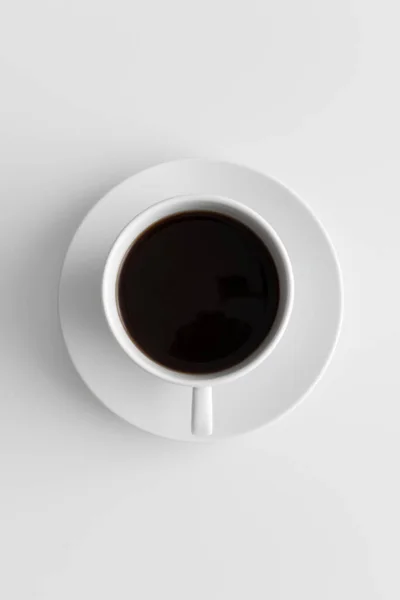 Beyaz Bir Masada Bir Fincan Kahvenin Üst Görüntüsü — Stok fotoğraf