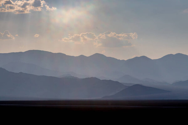 Silhouetted mountains in Death Valley, with evening light