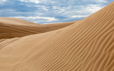 Ridges and textures at the Imperial Sand Dunes in California clipart
