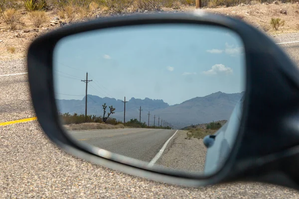 Looking Rear View Mirror Car Telegraph Poles Alongside Road Desert — Stock Photo, Image