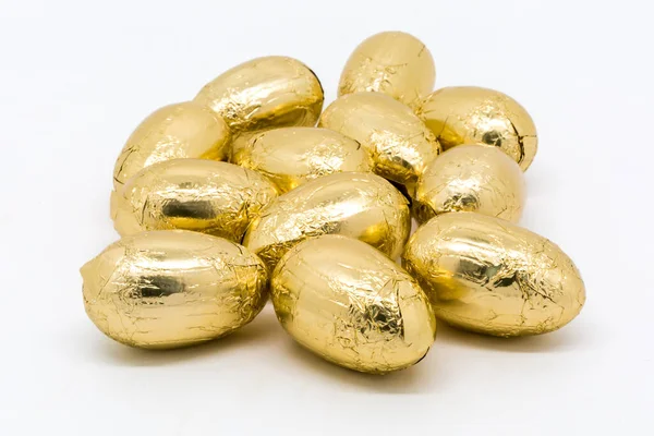 Chocolate Eggs Wrapped Gold Foil White Background Royalty Free Stock Images