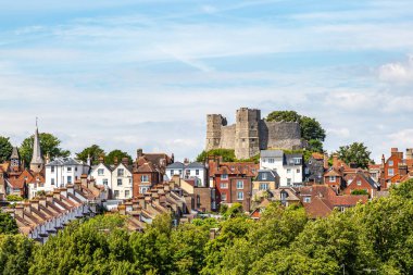 A view over the castle and town of Lewes in Sussex, on a summers day clipart
