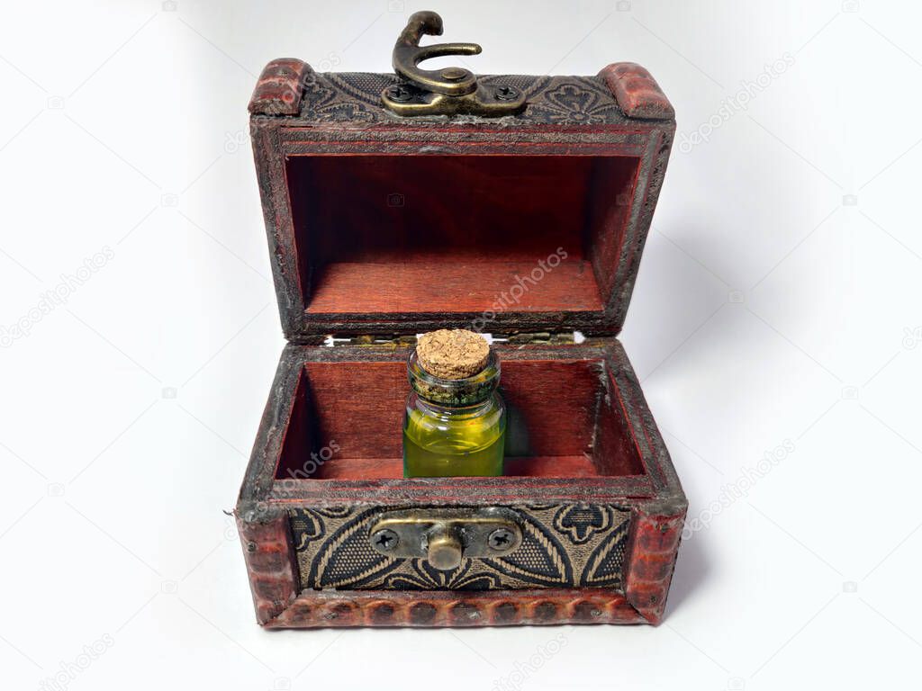 Wood chest with potion yellow. old treasure casket isolated on white background. Alchemy set with flasks. small glass bottles with colored liquid for game role play. magic potions.