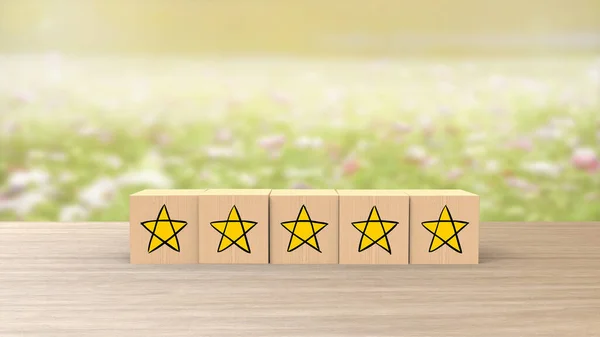 Wooden Cartoon Cube Five Yellow Star Review Blue Field Flowers — стоковое фото