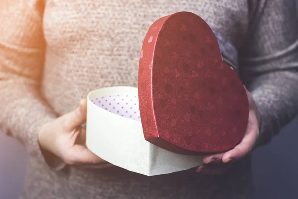 Woman Opens Gift Form Heart Close — Free Stock Photo