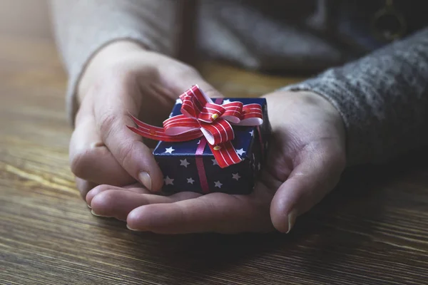 Woman Holding Blue Gift Box Her Hands Close — Free Stock Photo