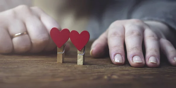 Woman Sits Folded Hands Next Clothes Pegs Heart Stock Photo