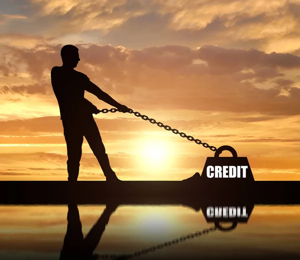 Sylwetka Człowieka Powiązane Dużym Obciążeniem Pod Nazwą Kredyt Ciągnie Ciężko — Zdjęcie stockowe