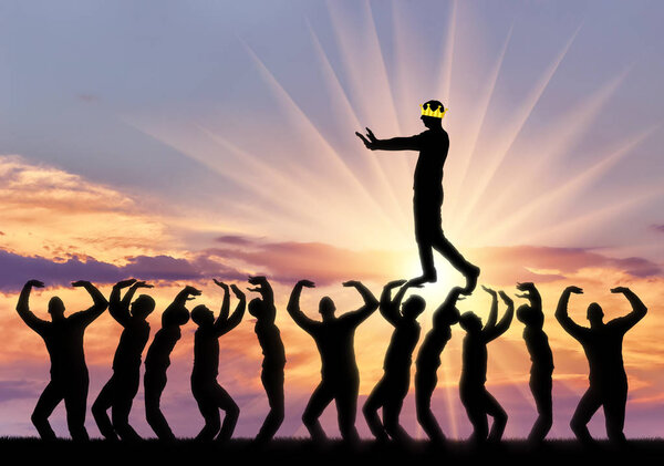 A selfish man walks the heads of people, he is blind, his crown closes his eyes to see. Conceptual scene of a narcissistic and selfish businessman