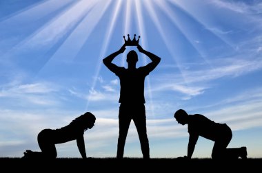 Silhouette of a man and a woman worshiping a man who puts a crown on his head clipart