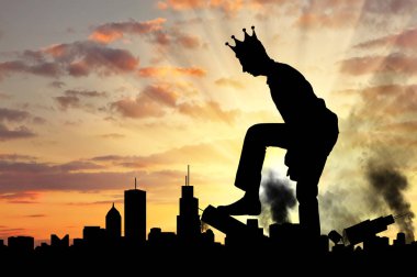 Big selfish man with a crown destroys the city on his way clipart