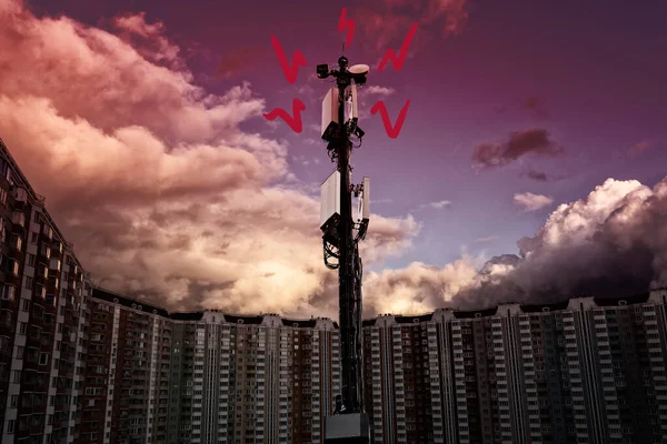 telecommunication tower with signal wave picture. a tower stands in the middle of a residential area, passing waves around it. ominous sky