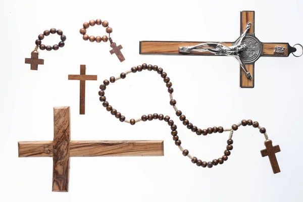 Christian crosses and rosary isolated on white background