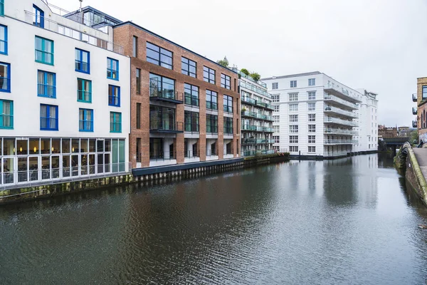 The Regent\'s Canal near to the Camden Market with modern buildings around in London, England, United Kingdom