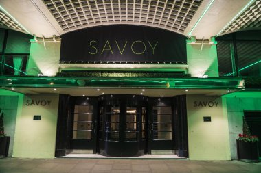 London, United Kingdom - January 1, 2017: Entrace of the Savoy at night hotel in London, England, United Kingdom clipart