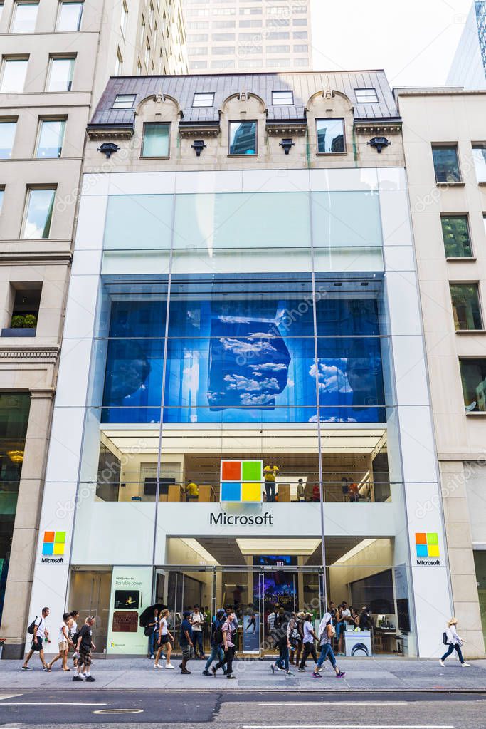 New York City, USA - July 28, 2018: Microsoft Corporation (MS) shop, multinational technology company, in Fifth Avenue (5th Avenue) with people around in Manhattan in New York City, USA