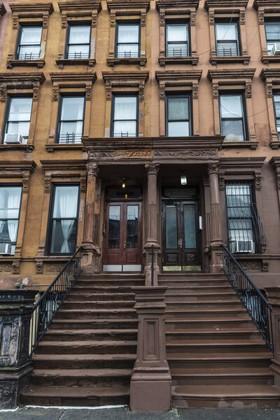 Old typical houses in the Harlem neighborhood in Manhattan, New York City, USA