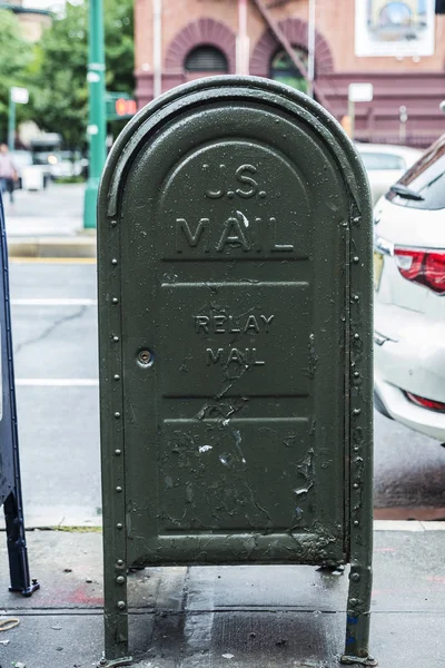 Old metal postal mail box in the Harlem neighborhood in Manhattan, New York City, USA