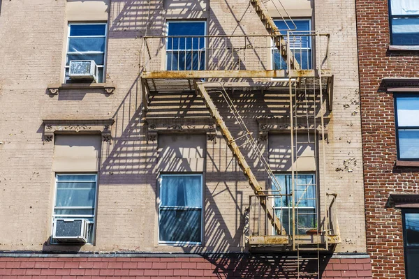 Old typical houses with its emergency stairs in the Brooklyn neighborhood in Manhattan, New York City, USA