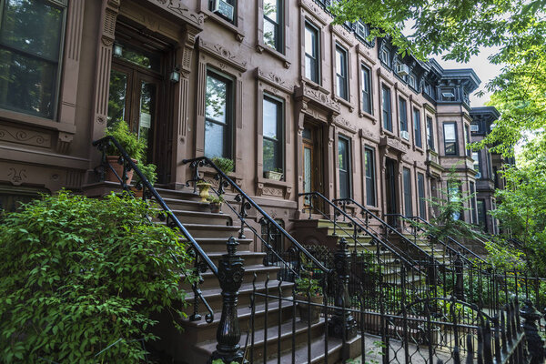 Old typical houses in the Brooklyn neighborhood in Manhattan, New York City, USA