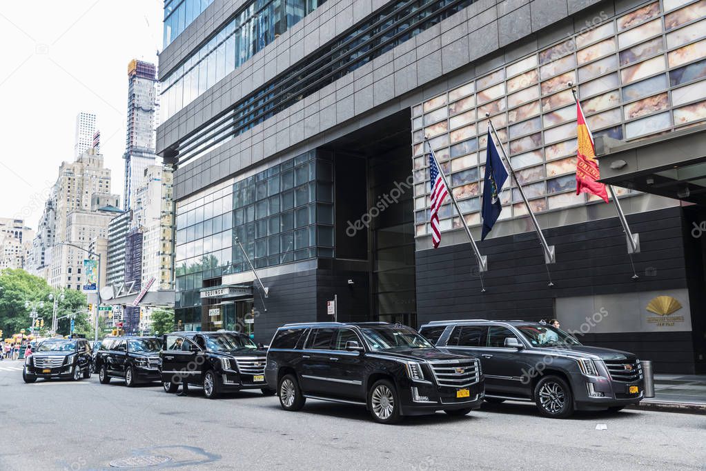 New York City, USA - July 28, 2018: Facade of the Mandarin Oriental New York Hotel with black Cadillac Escalade and people around in Manhattan, New York City, USA