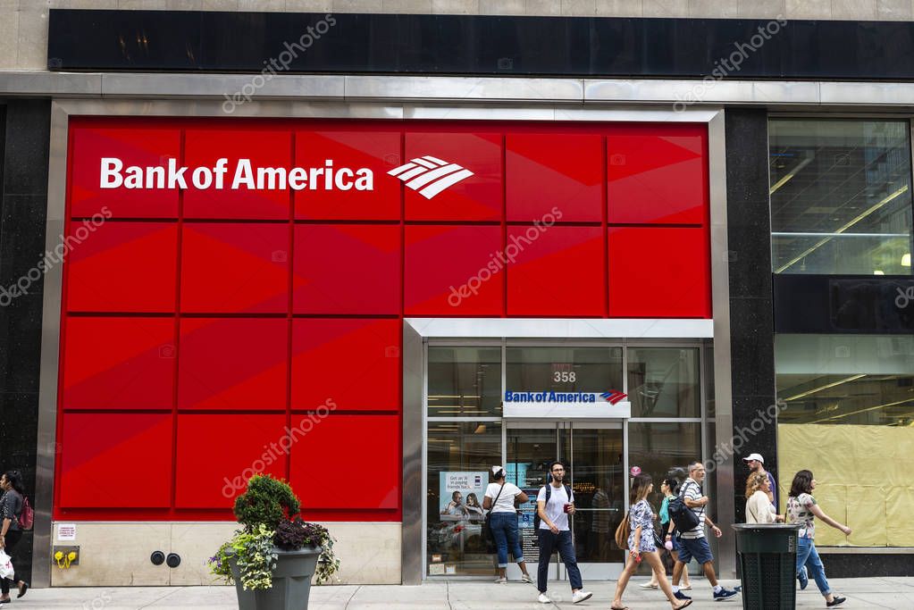 New York City, USA - July 31, 2018: Facade of a bank branch of Bank of America on the street with people around in New York City, USA