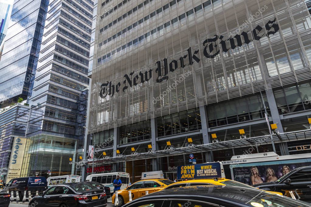 New York City, USA - August 2, 2018: Facade of The New York Times (NYT and NYTimes) headquarters with traffic and people around on Eighth Avenue, Manhattan, New York City, USA