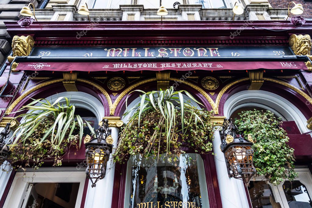 Dublin, Ireland - December 30, 2019: Facade of the Millstone Restaurant in Dame Street of Dublin, Ireland