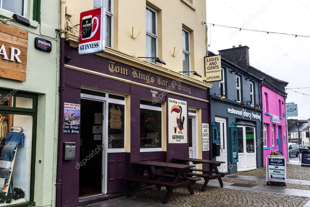 Clifden, Ireland - January 4, 2020: Shopping street with restaurants, irish pubs and shops in the town of Clifden, in the region of Connemara, Ireland