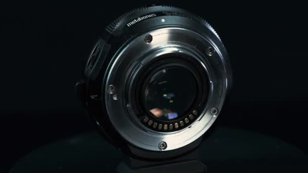 TOMSK, RUSSIA - May 28, 2020: Metabones 스피드 부스터 0.71 ultra standing on a black turtable, Micro Four Thirds System, black background — 비디오