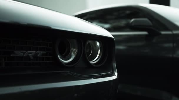 Tomsk, Rússia - 17 de julho de 2020: Black Dodge Challenger SRT Hellcat automobile close up front view — Vídeo de Stock