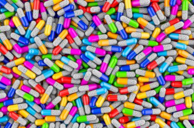 Renkli kapsüllerin arka planı. 3B görüntüleme