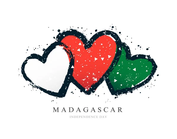 Üç kalp şeklinde Madagaskar bayrağı. — Stok Vektör