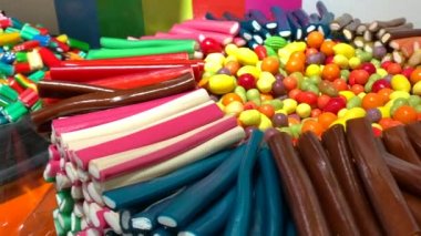 Different tasty multi-colored bright sweet chewing baby marmalade. Marmalade in sugar.