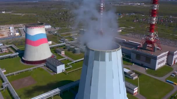 Aerial view of a thermal power plant. Cogeneration plant. Industrial heat supply for a big city. — Stock Footage Aerial View Thermal Power Plant Cogeneration Plant Industrial Heat Supply Video Clip