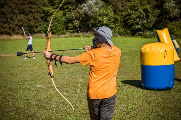 Teenage Boy Playing Archery Tag Meadow — Stock Photo, Image