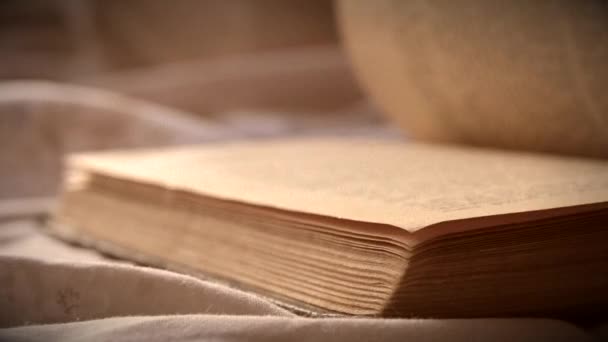 Turn over sheets an old vintage book close-up lying on a flat surface. — Stock Video