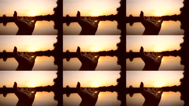 POV Black silhuetten av hand flyttar det in luft, genom fingrarna strålar av sol — Stockvideo