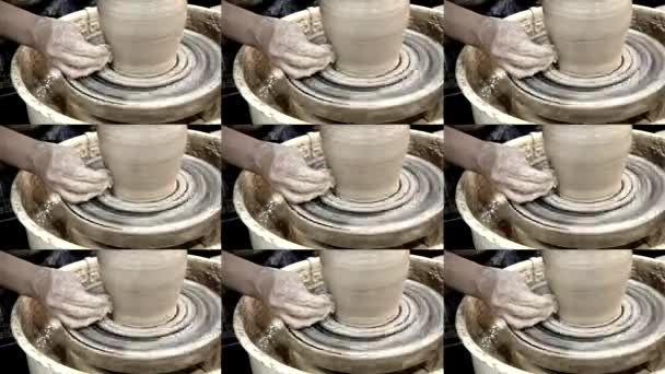 Workshop molding of clay on potters wheel. Dirty hands in the clay. — Stock Video