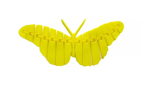 Objeto amarelo claro brilhante em forma de brinquedo borboleta impresso na impressora 3d — Fotografia de Stock