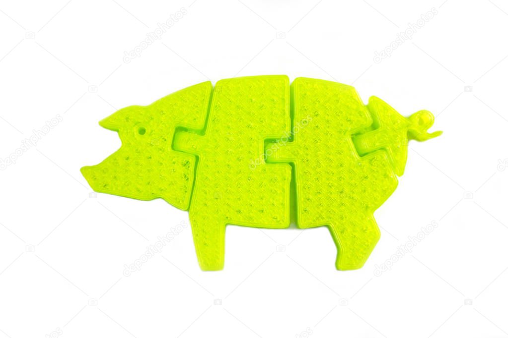 Bright light yellow object in shape of pig toy printed on 3d printer