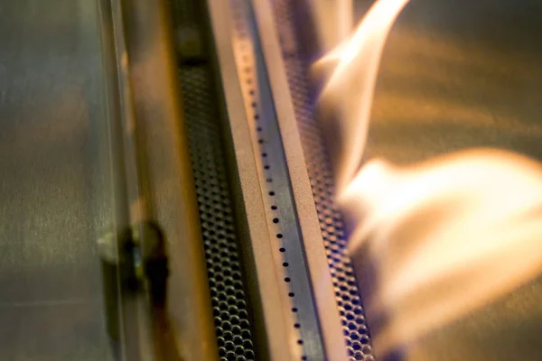 Modern bio fireplot fireplace on ethanol gas. Smart ecological alternative technologies. Contemporary biofuel on ethanol close-up. Energy saving innovation. Interior inside a house